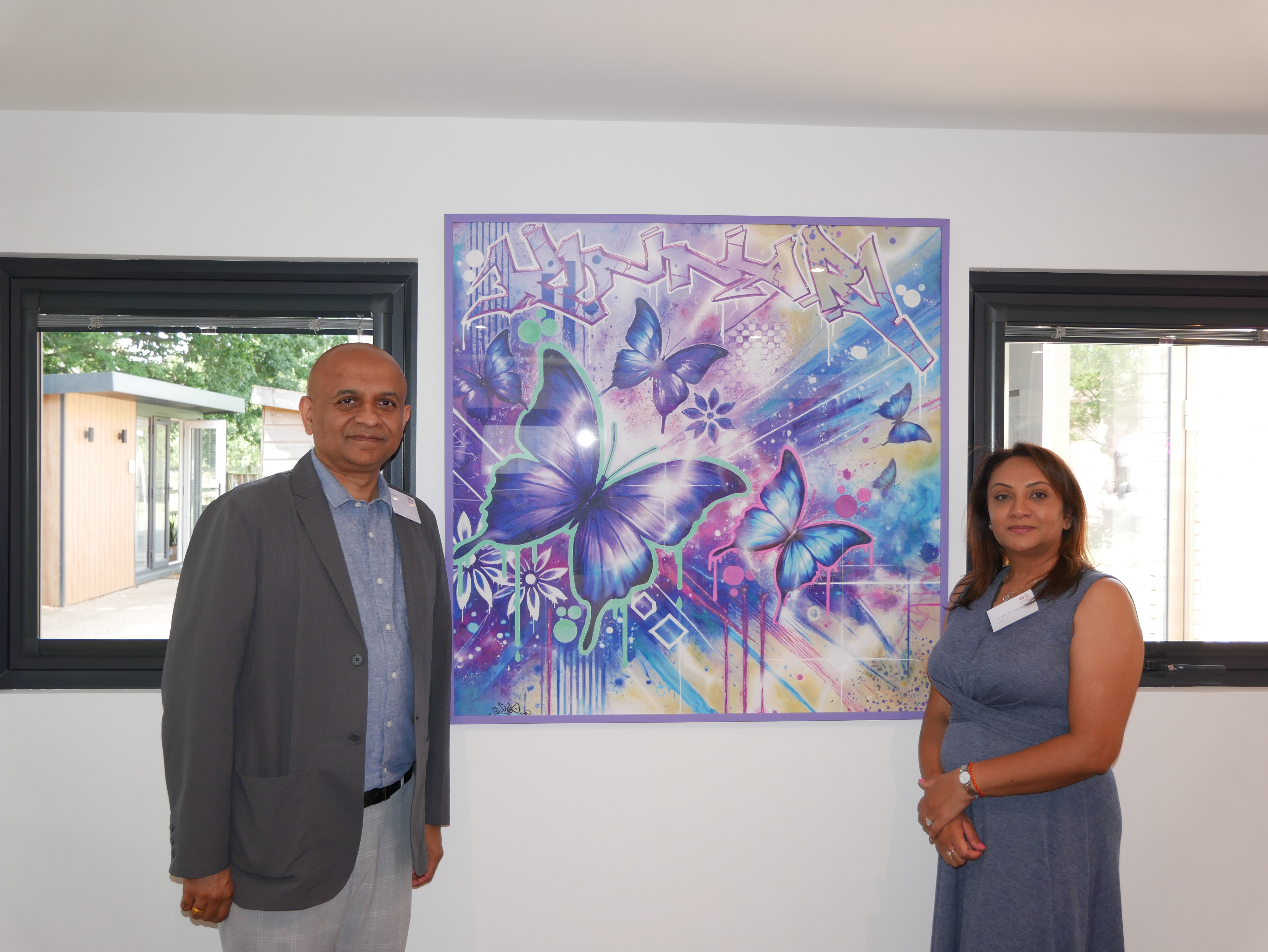 Kinnari's parents with the memorial artwork