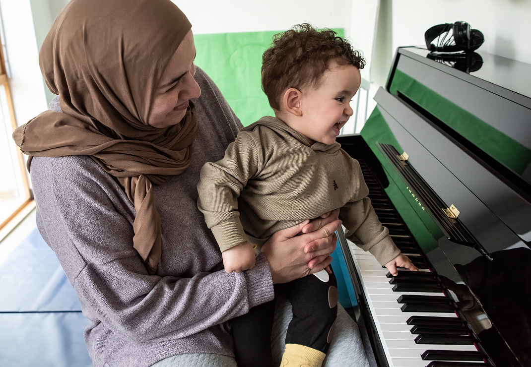 Mum and child at piano